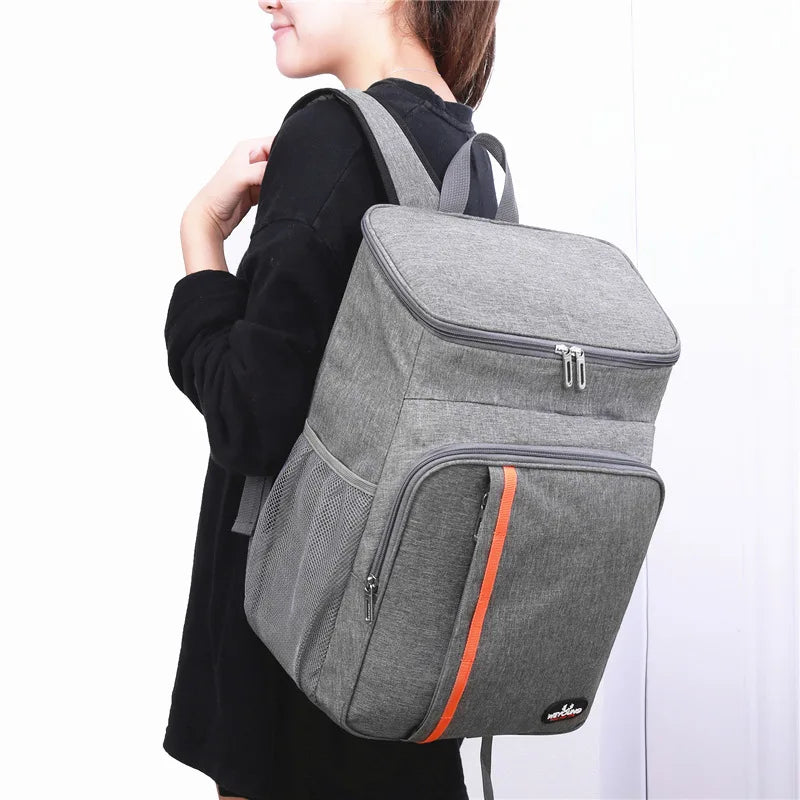 Nomad 18L Leakproof Thermal Cooler with black exterior, sturdy handle, and insulated interior for keeping drinks and food cold or hot.