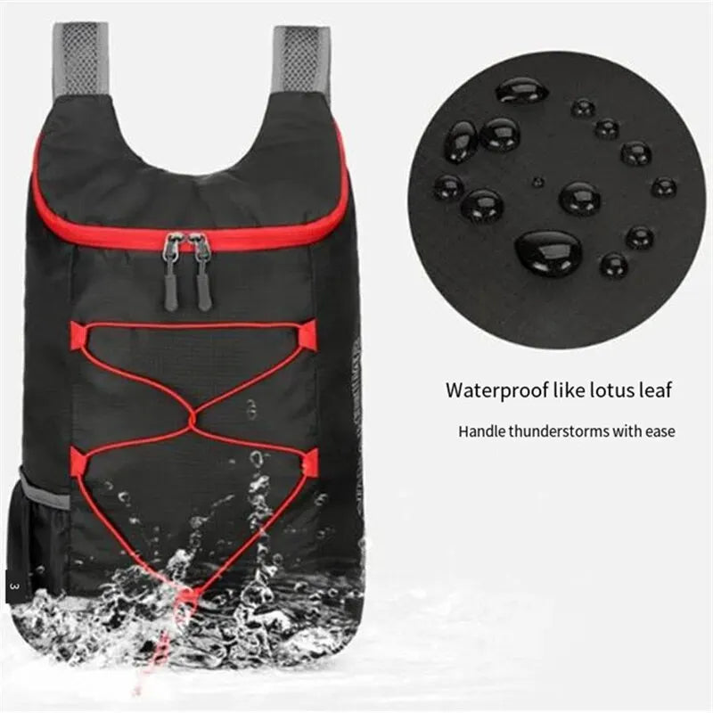 Nomad Pacific Supply PocketPack ultralight folding backpack open to show 20L waterproof trail daypack in black fabric