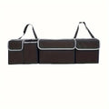 Nomad Trunk Elite hanging organizer in Oxford cloth, designed for SUVs and hatchbacks, with multiple compartments for storage.