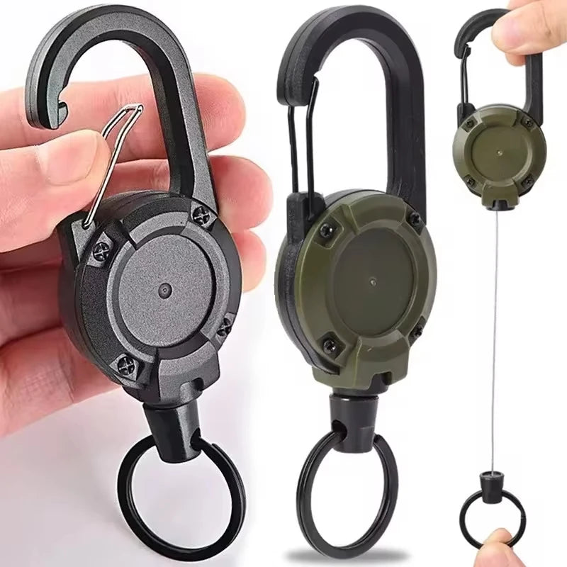 Nomad Pacific Supply heavy-duty retractable carabiner and key reel with black and silver design, durable and practical for outdoor use