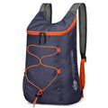 Nomad PocketPack folding backpack in waterproof material, 20L capacity, lightweight and compact for outdoor trail adventures.