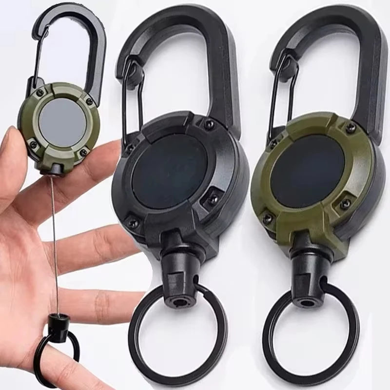 Heavy-duty retractable carabiner and key reel by Nomad Pacific Supply, with durable metal clip and compact design for everyday use.