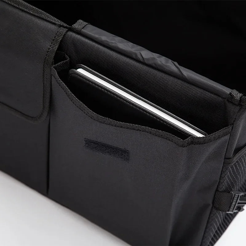 Nomad Cabin Caddy freestanding car storage box with integrated tablet holder, in black with textured finish, designed for vehicle organization.