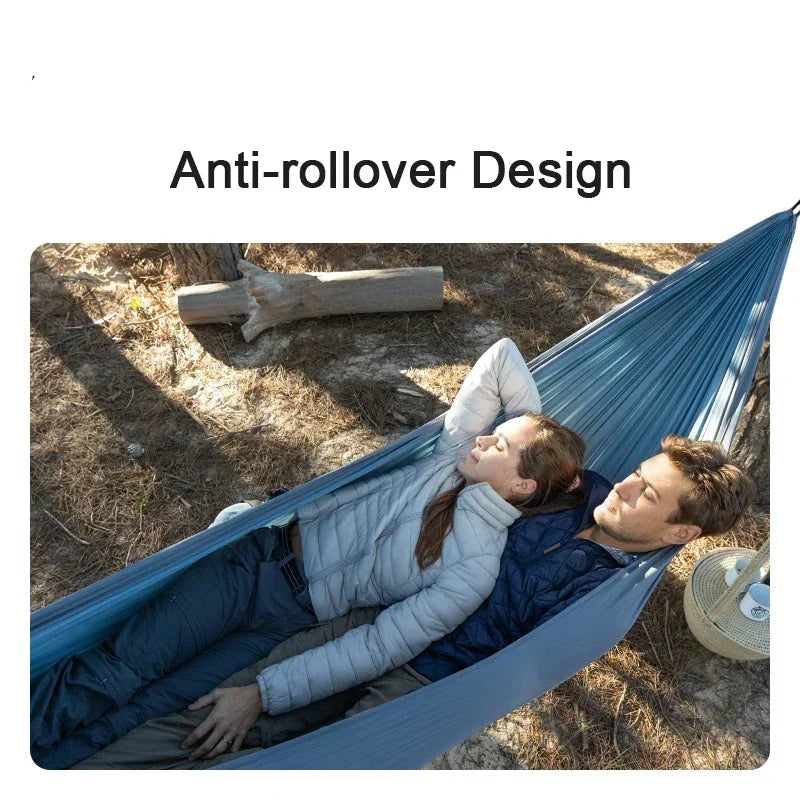 Nomad x Naturehike ultralight swing hammock for outdoor camping, portable sleep gear, shown hanging in a natural setting