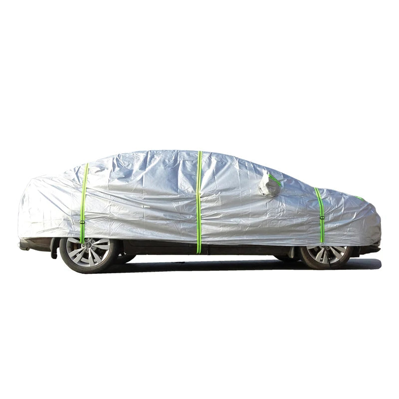 Heavy-duty Nomad Shield outdoor car cover protecting a vehicle from all weather conditions, made for all-exterior outdoor use.
