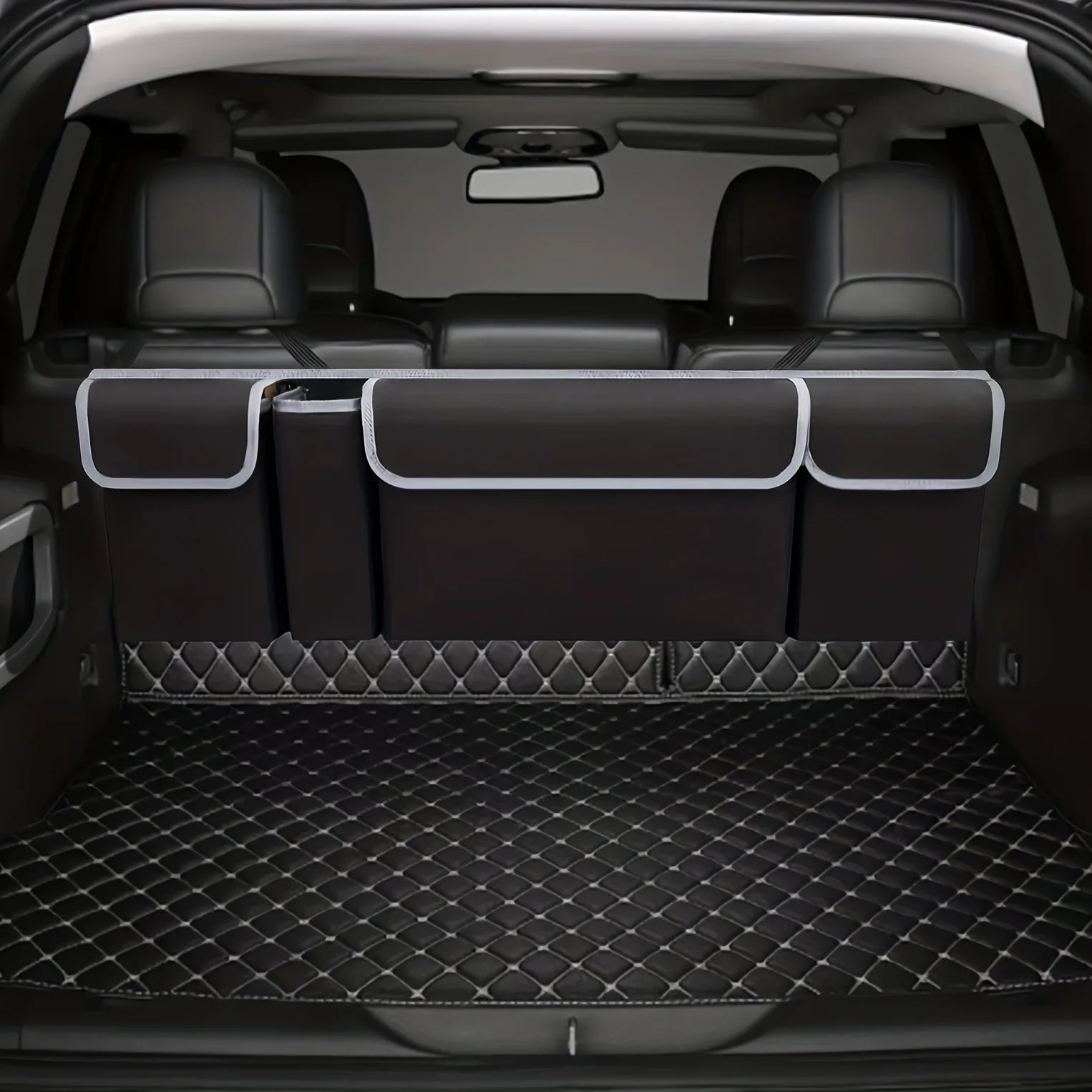 Nomad Trunk Elite hanging organizer in Oxford cloth with multiple compartments, designed for SUVs and hatchbacks.