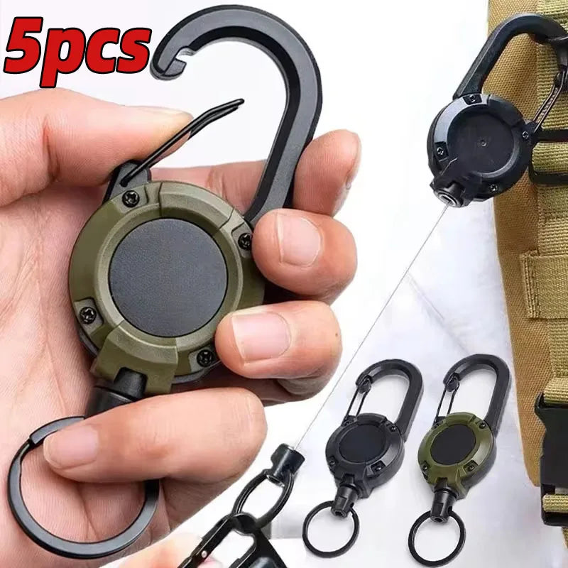 Heavy-duty retractable carabiner and key reel by Nomad Pacific Supply, with durable metal clip and compact design for secure key holding