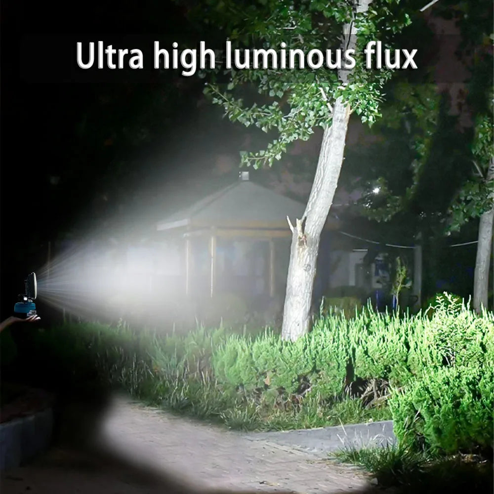Nomad Jobsite Glo LED work light attached to Makita 18V power tool, providing bright illumination for construction and work tasks.