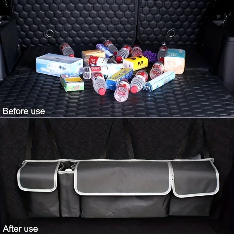 Nomad Trunk Elite hanging organizer in oxford cloth with multiple compartments inside an SUV trunk for vehicle storage.