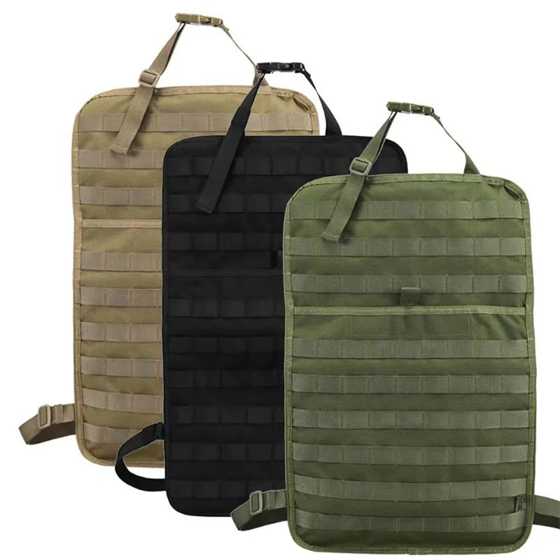 Nomad Pacific Supply tactical car seat back organizer hanging on vehicle seat with multiple storage pockets and compartments