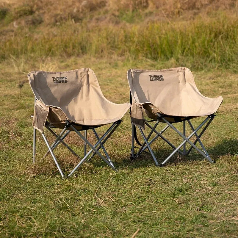 Nomad Heavy-Duty Folding Camping Chair by Nomad Pacific Supply, portable steel moon chair with sturdy frame and comfortable seating.
