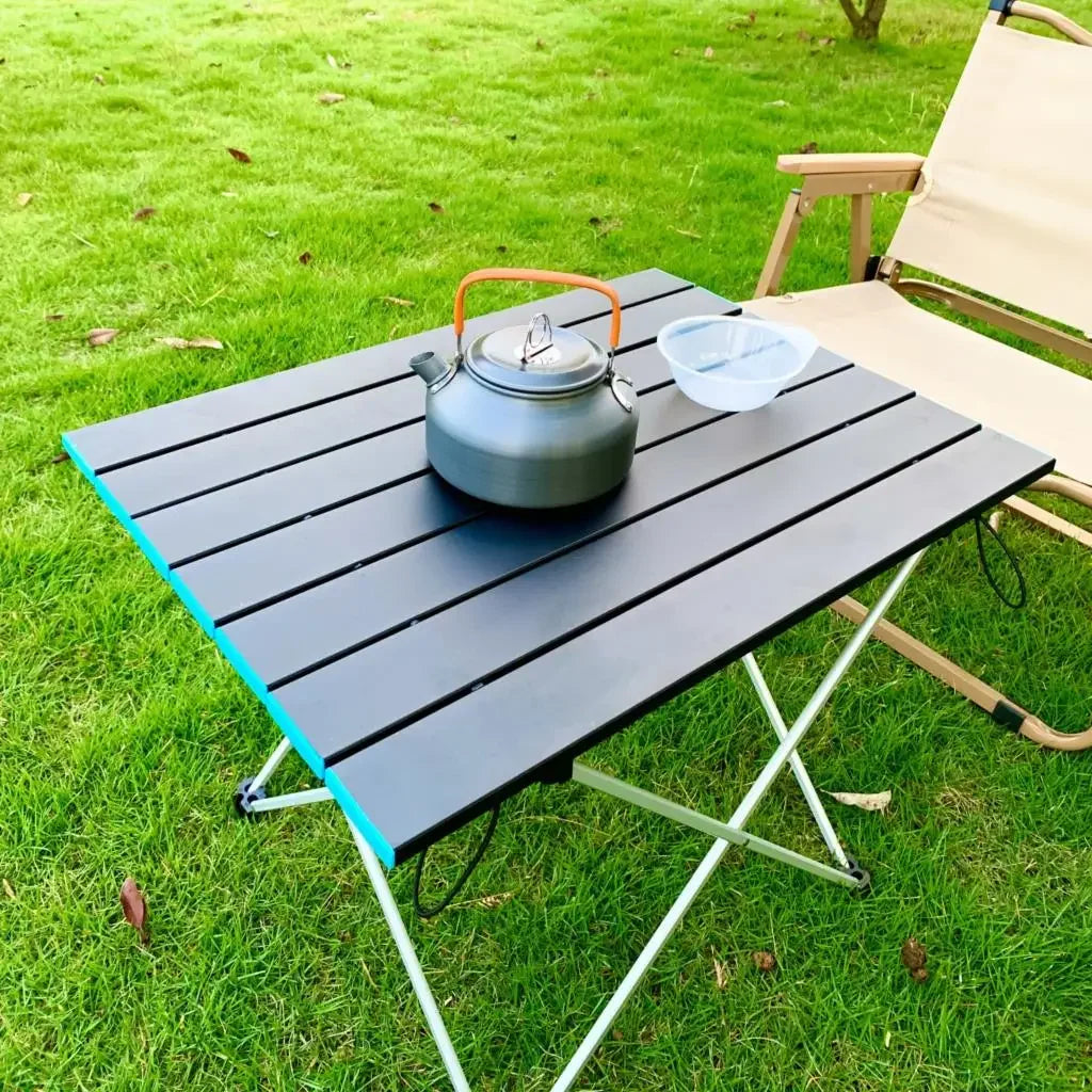 Nomad Ultralight Aluminum Folding Camping Table with roll-up design, portable dinner desk for outdoor camping and picnics.